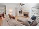 Spacious living room featuring a brick fireplace, built-in shelving, and comfortable seating at 5612 Crossfield Dr, Raleigh, NC 27613