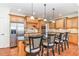 Island kitchen with granite countertops, stainless steel appliances, and breakfast bar at 58 Alecia Ct, Clayton, NC 27527