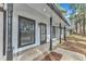 Inviting front porch with black columns and updated flooring at 5808 Farm Gate Rd, Raleigh, NC 27606