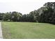 Large grassy backyard with a volleyball net at 5891 Baker Ln, Rocky Mount, NC 27803