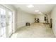 Finished basement recreation room with access to the pool area at 5891 Baker Ln, Rocky Mount, NC 27803