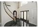 Elegant entryway with marble floor and curved staircase at 5891 Baker Ln, Rocky Mount, NC 27803