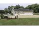 House exterior showcasing a large, three-car garage and spacious backyard at 5891 Baker Ln, Rocky Mount, NC 27803