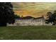 Beautiful house exterior at sunset with a large backyard at 5891 Baker Ln, Rocky Mount, NC 27803