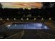 Stunning night view of an illuminated swimming pool at 5891 Baker Ln, Rocky Mount, NC 27803