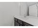 Modern bathroom with dark vanity and quartz countertop at 608 Marshskip Way, Rolesville, NC 27587