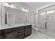 Bathroom featuring marble floors, a double vanity, and a glass shower enclosure at 608 Marshskip Way, Rolesville, NC 27587