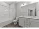 Bathroom with a double vanity, bathtub, and tile floors at 608 Marshskip Way, Rolesville, NC 27587
