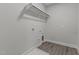 A large laundry room with washer/dryer hookups and shelving at 608 Marshskip Way, Rolesville, NC 27587