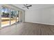 Living room featuring hard surface floors and sliding doors to the backyard and green space at 608 Marshskip Way, Rolesville, NC 27587