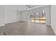 Living room featuring hard surface floors and sliding doors to the backyard at 608 Marshskip Way, Rolesville, NC 27587