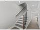 A staircase with white trim and hardwood flooring at 608 Marshskip Way, Rolesville, NC 27587
