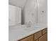 Bathroom with a white countertop, light brown cabinets, and a large mirror for a bright and modern feel at 610 Marshskip Way, Rolesville, NC 27587