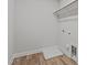 A practical, minimalist closet with rod and shelf, offering storage and laundry hookups, ready for your needs at 610 Marshskip Way, Rolesville, NC 27587