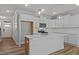 Bright, eat-in kitchen with stainless steel appliances, quartz countertops, and white cabinetry at 610 Marshskip Way, Rolesville, NC 27587