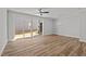 Spacious living room with sliding glass doors and modern light fixture at 610 Marshskip Way, Rolesville, NC 27587