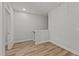 Upstairs hallway with wood-look floors and access to other rooms at 610 Marshskip Way, Rolesville, NC 27587