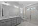 Elegant bathroom with double vanity and a marble shower at 612 Marshskip Way, Rolesville, NC 27587
