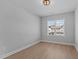 Bright bedroom with wood-look floors and a window at 612 Marshskip Way, Rolesville, NC 27587