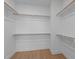 Walk-in closet with ample shelving and hanging space at 612 Marshskip Way, Rolesville, NC 27587