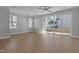 Spacious dining area with hardwood floors, sliding doors, and ceiling fan at 612 Marshskip Way, Rolesville, NC 27587