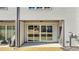 Rear view of the home with patio and sliding doors at 612 Marshskip Way, Rolesville, NC 27587