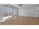 Living room with hardwood floors, sliding doors to patio, and ceiling fan at 612 Marshskip Way, Rolesville, NC 27587