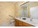 Bathroom with double vanity, shower, and patterned wallpaper at 617 Eyam Hall Ln, Apex, NC 27502