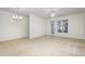 Bright living room with access to balcony at 617 Eyam Hall Ln, Apex, NC 27502
