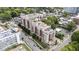 Stunning aerial view of a luxurious multi-story condo building surrounded by lush trees and city streets at 618 N Boylan Ave # 826, Raleigh, NC 27603
