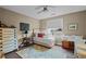 Cozy bedroom with a ceiling fan, dresser, and a cushioned window bench at 618 N Boylan Ave # 826, Raleigh, NC 27603