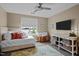 Comfortable bedroom with a ceiling fan and TV, perfect for relaxing and unwinding after a long day at 618 N Boylan Ave # 826, Raleigh, NC 27603