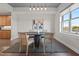 Bright dining room boasts a modern table, stylish chairs, and artistic decor at 618 N Boylan Ave # 826, Raleigh, NC 27603
