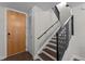 Stylish entryway features a modern staircase with wood treads and a metal railing at 618 N Boylan Ave # 826, Raleigh, NC 27603