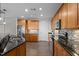 Well-lit kitchen boasts granite countertops, stainless steel appliances, and wood-look floors at 618 N Boylan Ave # 826, Raleigh, NC 27603