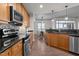 Contemporary kitchen with sleek appliances and an open layout to the dining area at 618 N Boylan Ave # 826, Raleigh, NC 27603