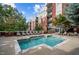 Relaxing pool and lounge area in front of building with brick facade and lots of natural light at 618 N Boylan Ave # 826, Raleigh, NC 27603