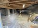 Unfinished basement with vapor barrier at 620 Rollins Mill Rd, Holly Springs, NC 27540