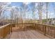 Wooden deck overlooking wooded backyard at 620 Rollins Mill Rd, Holly Springs, NC 27540