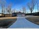 House exterior with a long driveway at 620 Rollins Mill Rd, Holly Springs, NC 27540