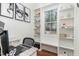 Home office with built-in shelving and window seat at 620 Rollins Mill Rd, Holly Springs, NC 27540