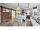 Main bedroom with king bed, barn door, and sitting area at 7152 Rex Rd, Holly Springs, NC 27540