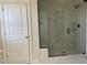 Bathroom with a large walk-in shower and marble tile at 82 Gin Branch Rd, Wendell, NC 27591