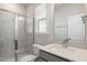 Bathroom with walk-in shower and gray vanity at 82 Gin Branch Rd, Wendell, NC 27591