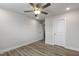 Bedroom with ceiling fan, double door closet, and wood floors at 82 Gin Branch Rd, Wendell, NC 27591