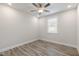 Bright bedroom with ceiling fan and wood-look flooring at 82 Gin Branch Rd, Wendell, NC 27591