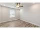 Bright bedroom with ceiling fan and wood-look flooring at 82 Gin Branch Rd, Wendell, NC 27591