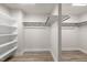 Spacious walk-in closet with built-in shelves and hanging rods at 82 Gin Branch Rd, Wendell, NC 27591