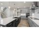 Modern kitchen featuring gray cabinets, white countertops, and stainless steel appliances at 82 Gin Branch Rd, Wendell, NC 27591