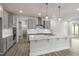 Modern kitchen with gray cabinets, white quartz countertops, and an island at 82 Gin Branch Rd, Wendell, NC 27591